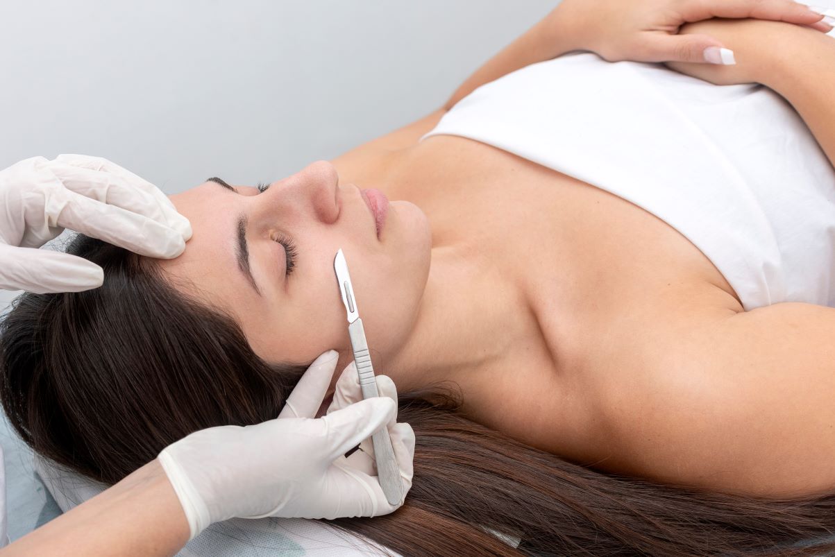 A woman getting dermaplaning preformed.