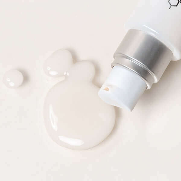 Affirm serum bottle close up, with product surrounding it.