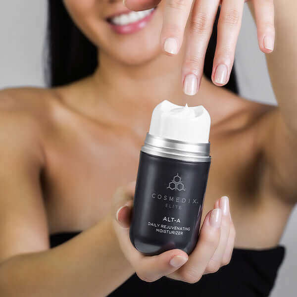 A woman touching the Alt A product to show consistency of the moisturizer