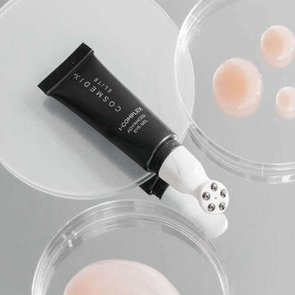 I-Complex tube laying on it's side , it helps smooth the look of wrinkles, brighten the look of under eyes and deeply hydrates the skin. Gentle enough for daytime use!