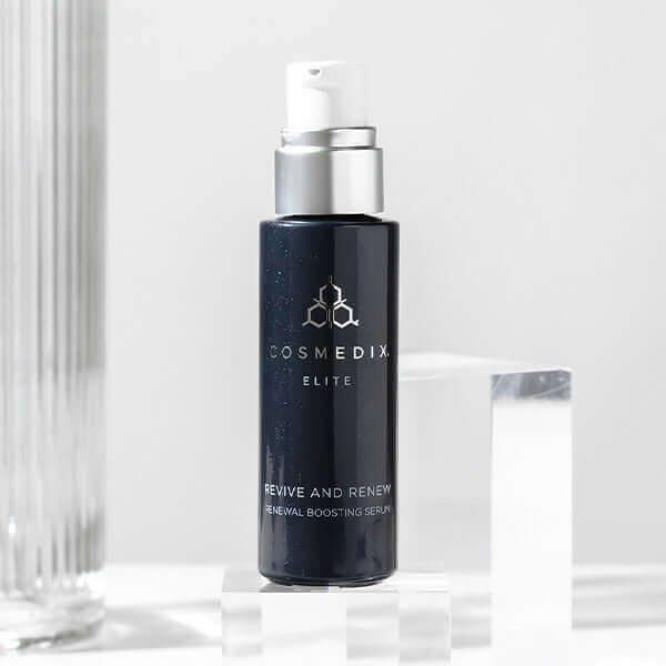 Revive serum with cap off by glass